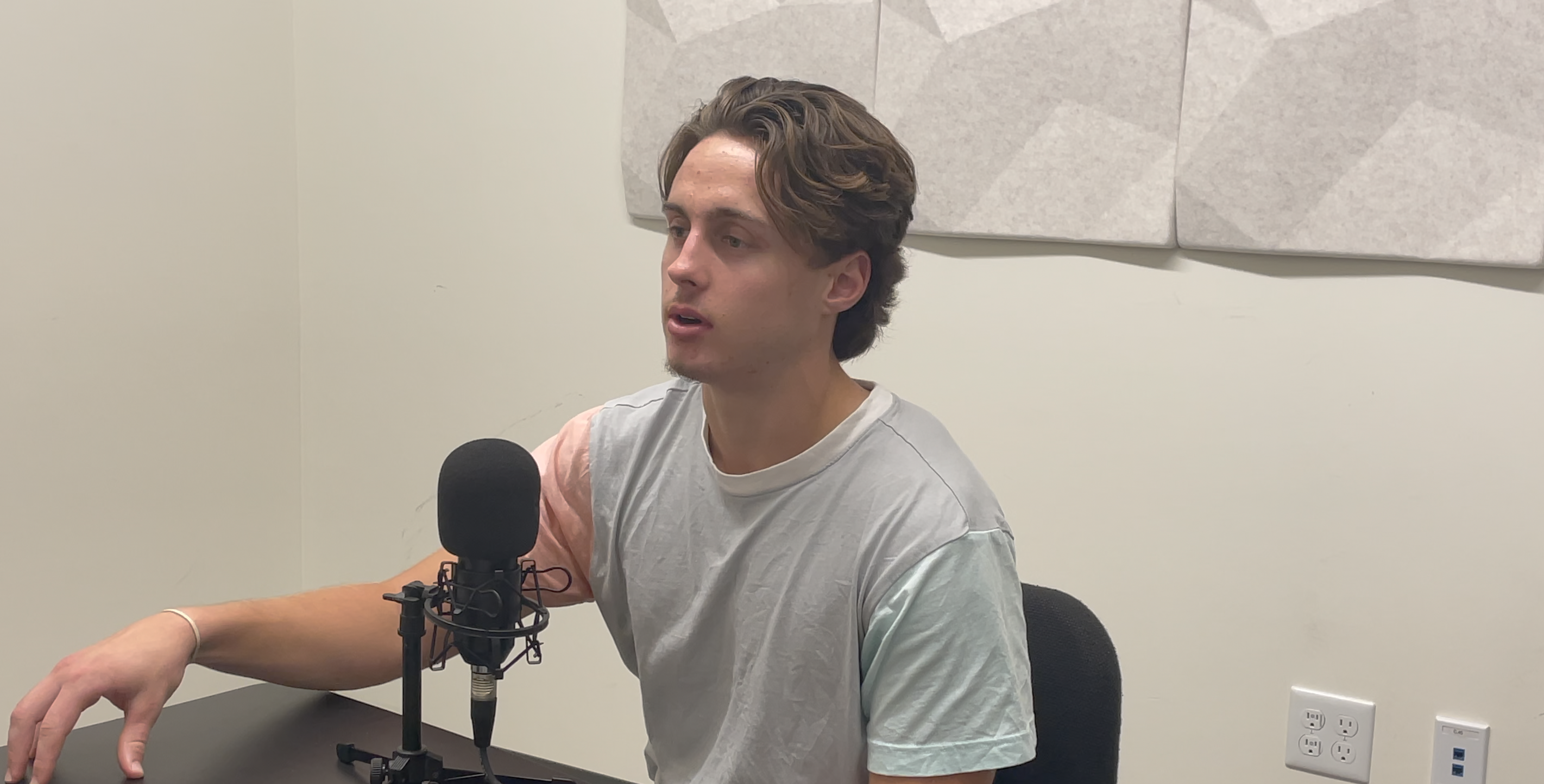 Gleason podcasting in his office  